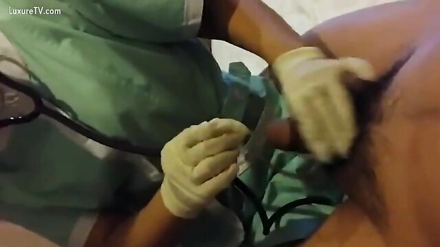 Chinese nurse in gloves examines hard cock in medical fetish exam