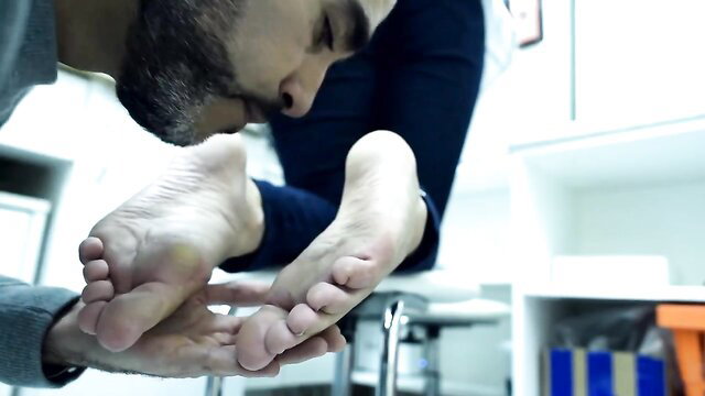 Bearded man worships big bare boss feet in footdom obedience training
