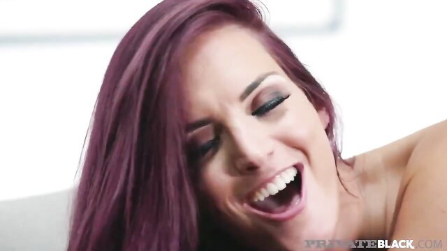 Lyen Parker smiling with purple hair in hot interracial scene