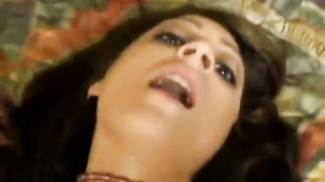 Brunette with piercing smiling open-mouthed in outdoor sex closeup