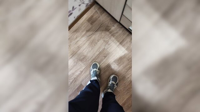 Woman in tight pants stands for shoe sniff fetish tease