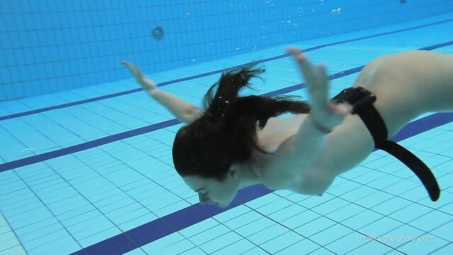 Nude teen swimmer with nice ass swims underwater, pussy closeup tease