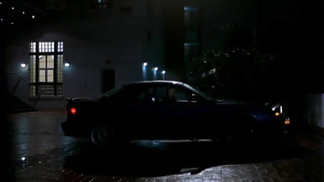 Natasha Henstridge in dark blue car at night - Second Skin 2000