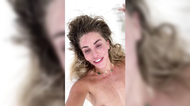 Bonnie Blue nude in bath post gangbang, wet blonde hair smiling