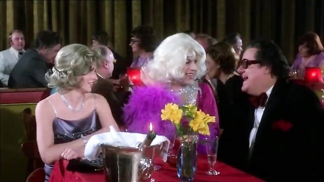 Vintage 1976 Danish adult film dinner scene with blonde in dress, drag queen, man laughing