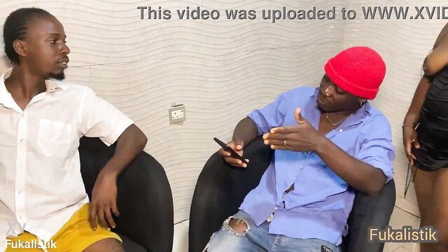 Three black Africans in casual clothes chatting intimately, amateur threesome tease