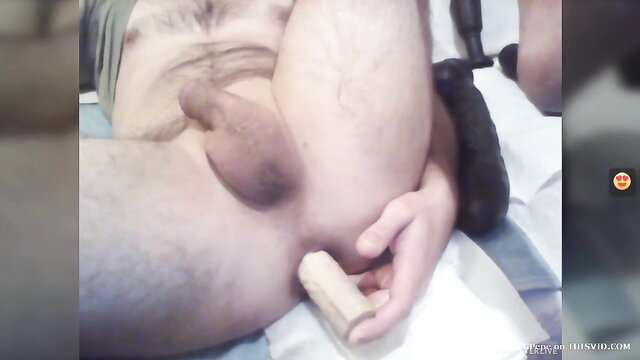 Hairy German guy holds thick dildo to his balls in amateur solo