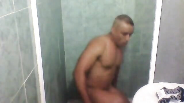 Muscular Arab man squatting nude in shower, sexy underwear fetish tease