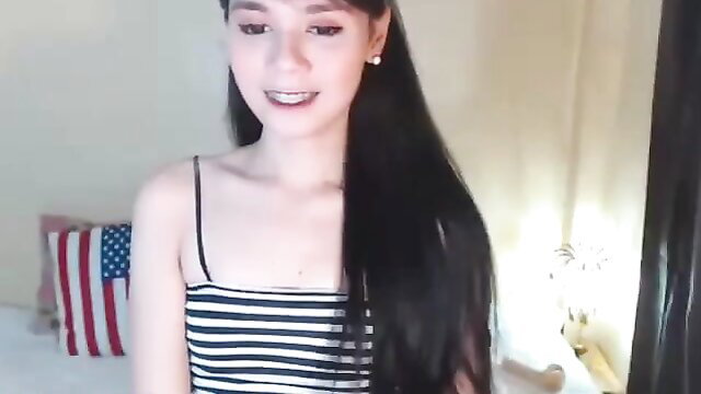 American cutie tranny in striped top smiles at camera