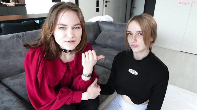 Two young Euro brunettes in choker & crop top tease on couch