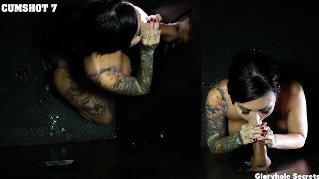 Tattooed Asian babe slurps cum from gloryhole cock closeup