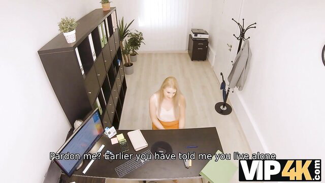 Blonde in orange top sits at desk in playful office sex VIP4K preview