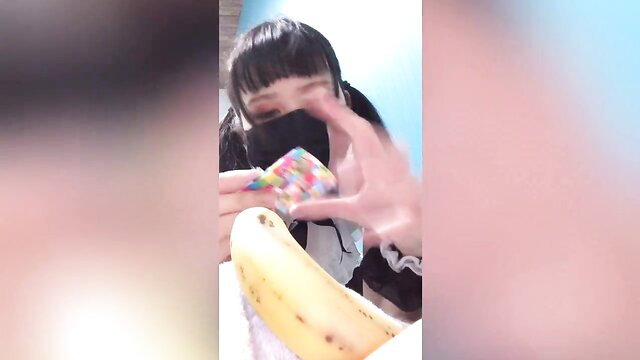 Japanese virgin in maid outfit holds banana & candy, tight pussy tease