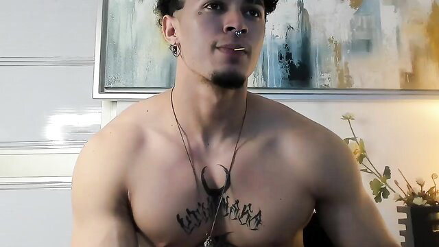Muscular Latino guy Jasson Rodriguez shirtless flexing tattoos