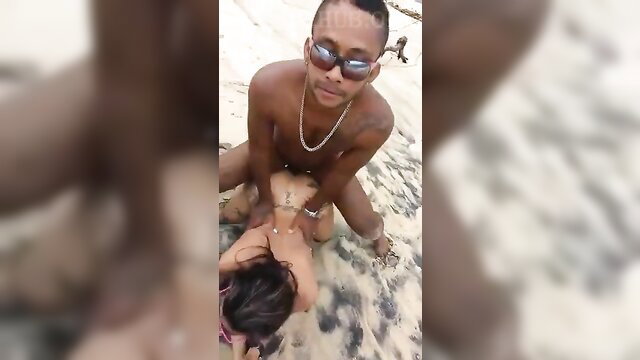 Skinny black beach boy squats nude over petite Asian girl outdoor sex