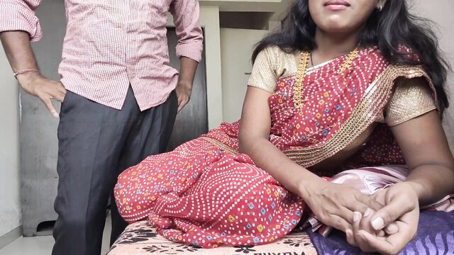 Desi Indian MILF in red saree sits with neighbor's wifey on bed