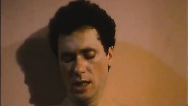 Closeup of man with curly hair in ecstasy, Forbidden Pleasures 1986 retro porn