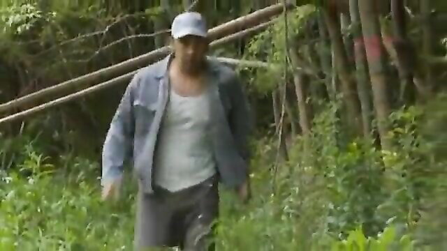 Old Asian man in denim jacket stalks through woods in JAV assault preview