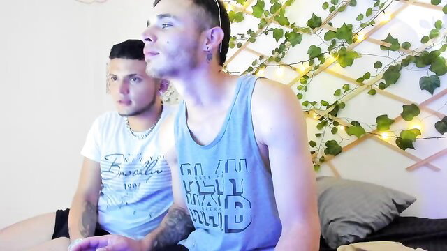 Two bearded twinks Aron Smith in tank tops, close-up gay tease