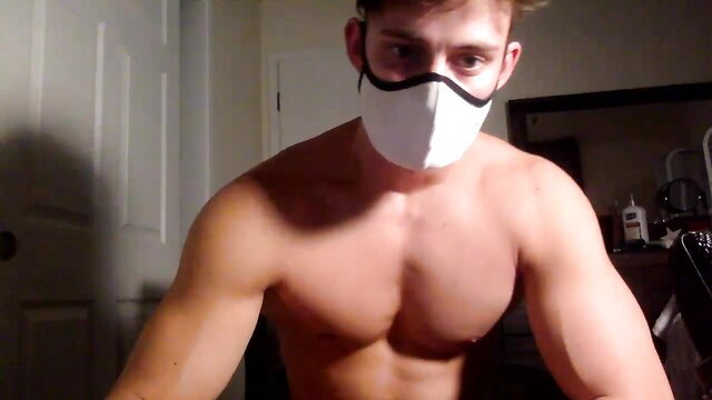Muscular white guy with mask teases shirtless, alluring fitness body