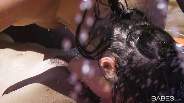 Tara Ashley wet lesbian outdoor kiss with babe, water dripping