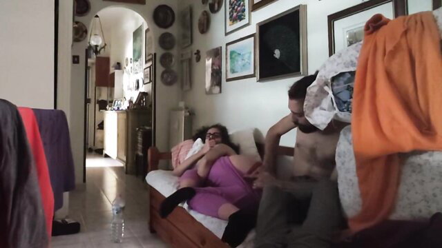 Amateur couple fucking on couch while friend watches TV