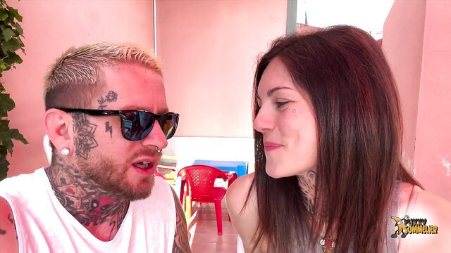 Tattooed guy flirts intimately with brunette gym girl, wet pussy lick tease