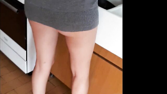 Hot maid in tight gray minidress bends over kitchen sink, no panties