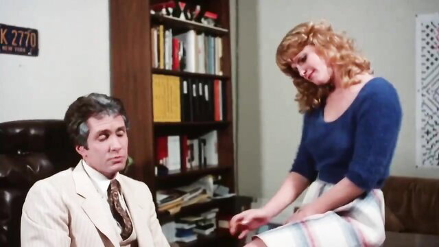 Vintage 1982 taboo porn: busty redhead in sweater skirt seduces suited man