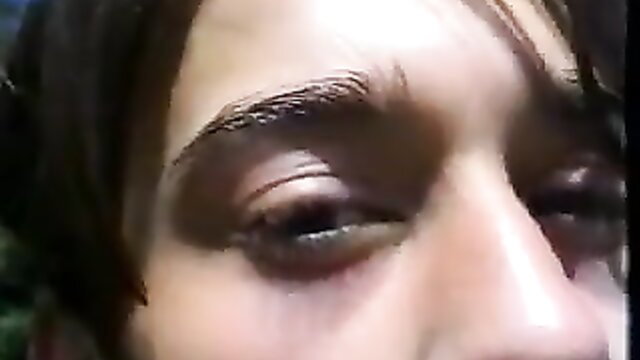 Closeup of woman's sultry brown eyes and nose in adult video thumbnail