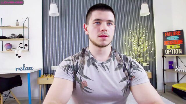 Muscular buzzcut guy in camo tank top, solo gay thumbnail