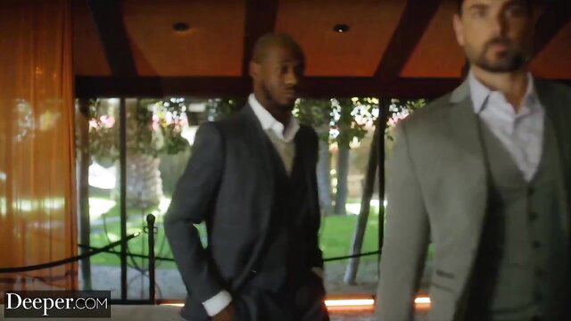 Savannah with black stud Anton and hubby in suits at entryway