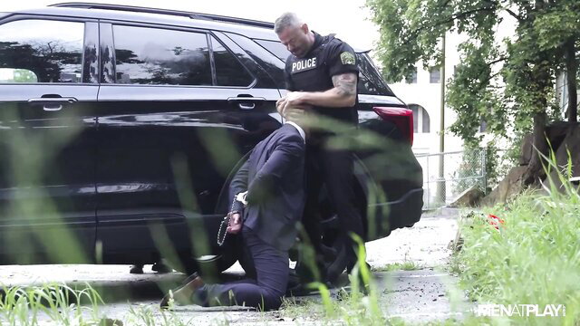 Muscle cop Only Matt barebacks suited Leo Bacchus outdoors