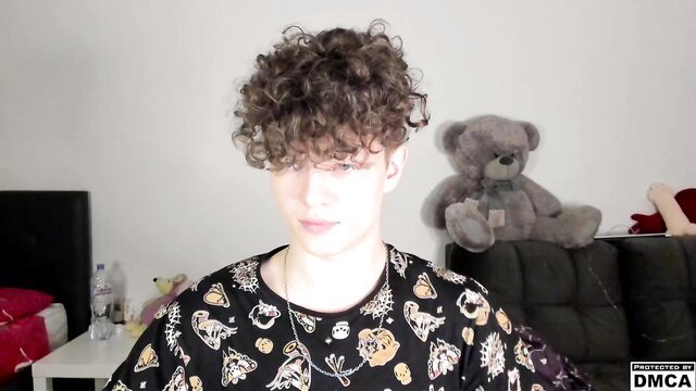 Curly-haired 18yo gay twink Manya sanush in bedroom with teddy bear