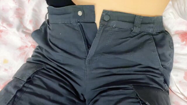 Tanned amateur teen unzipping tight cargo pants, exposing skin