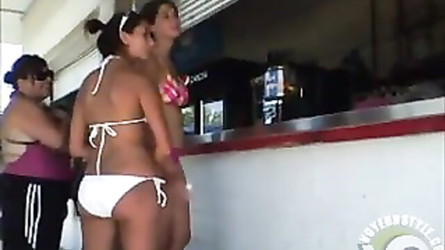 Gorgeous bikini maids at beach bar, curvy asses and tops