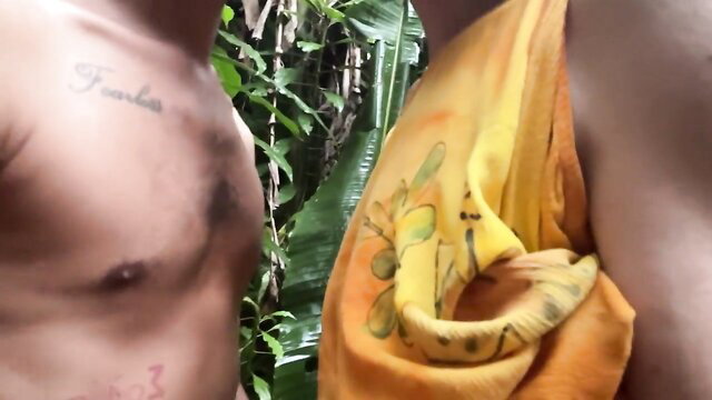 Hairy tattooed man with yellow towel outdoors jungle public fuck