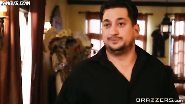 Kayla Kayden smiling seductively in black shirt, Brazzers scene