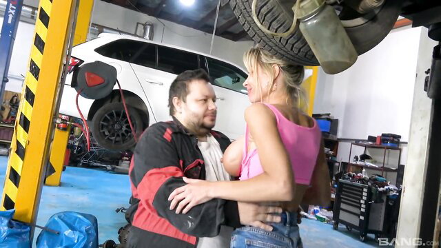 Adrianna Stelli's big fake boobs pressed on mechanic in garage