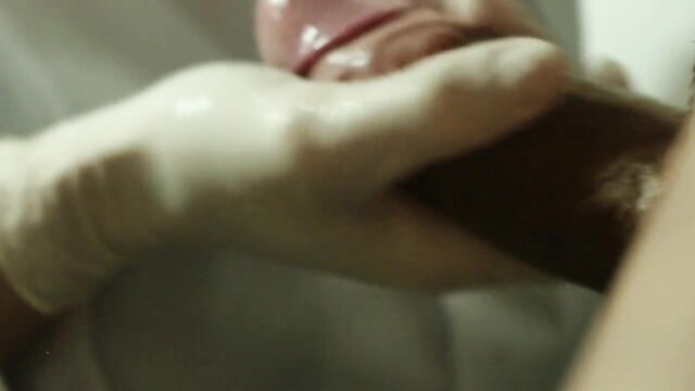 Gloved female doctor sucks big black cock in erotic medical treatment