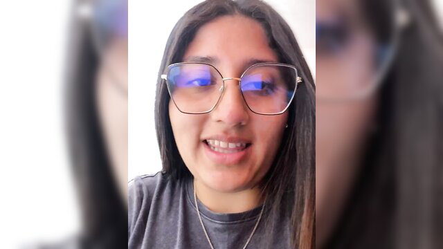 croftsmila smiling in blue glasses, young brunette amateur cam girl