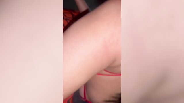Amateur Asian woman in red bra showing arm and sideboob closeup