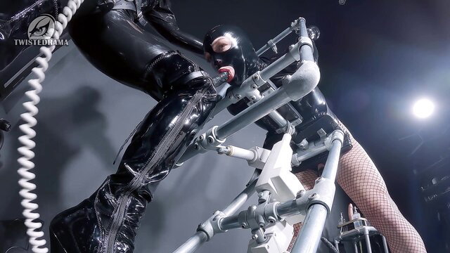 Woman in latex catsuit bound in merciless strappado machine