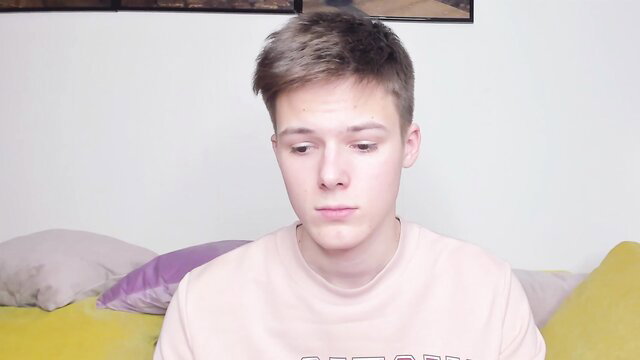 Young twink Timytwinkboy in pink hoodie on bed, smooth old-vs-young vibe