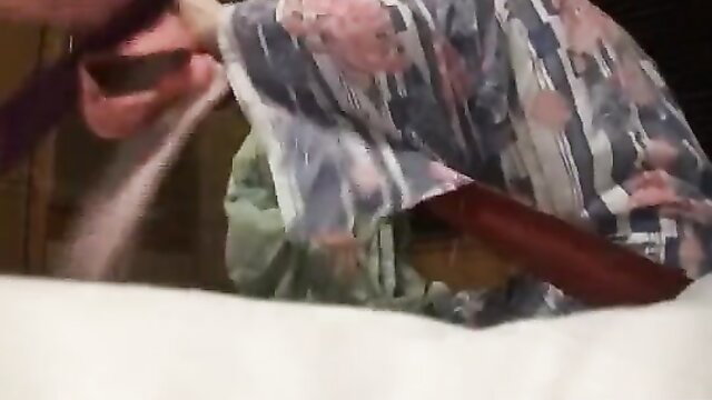 Japanese lesbians pouring sand in kimono at hot springs vacation