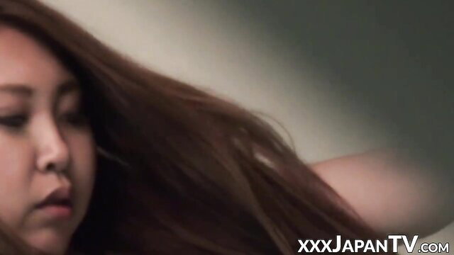 Horny Asian babe's face in ecstasy from hidden cam vibe toy