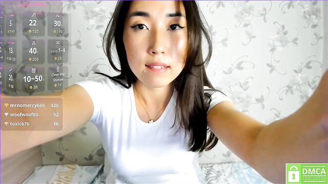 Cute Asian samiqlancher teases in tight white tank top on Chaturbate