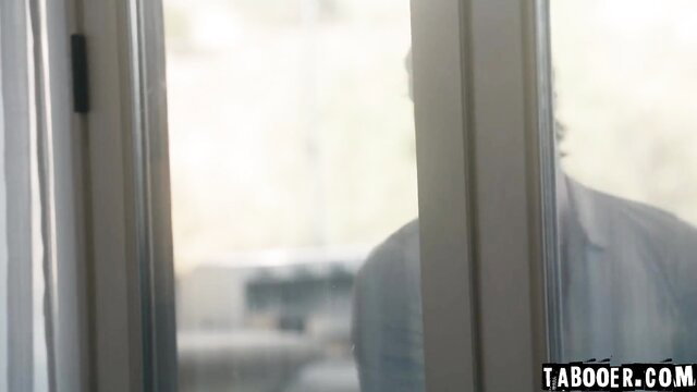 Penelope Woods back view through glass door in tight dress