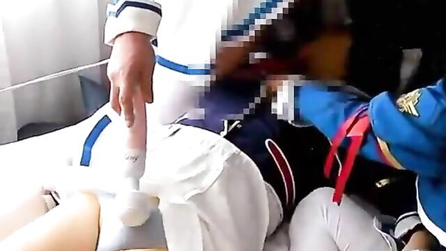 Japanese nurses in uniforms restrain patient, vibrator on crotch in JAV scene