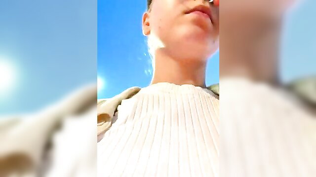 Bambi_lu closeup selfie POV in white sweater outdoors sunny day